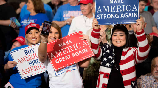Supporters take selfies and hold placards as President Donald Trump arrives to address a 'Make America Great Again' rally at the Kentucky Exposition Center in Louisville, Kentucky, March 20, 2017.