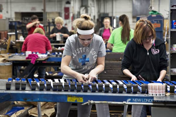 Employees place labels on prybars at the Vaughan & Bushnell Manufacturing Co. facility in Bushnell, Illinois.