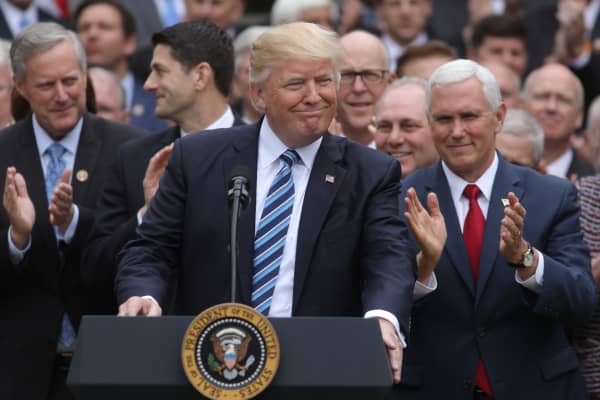 President Donald Trump (C) gathers with Vice President Mike Pence (R) and Congressional Republicans in the Rose Garden of the White House after the House of Representatives approved the American Healthcare Act, to repeal major parts of Obamacare and replace it with the Republican healthcare plan, in Washington, U.S., May 4, 2017.