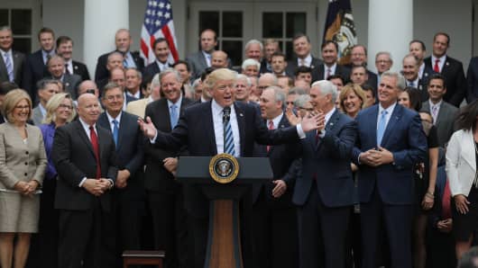 President Donald Trump (C) gathers with Congressional Republicans in the Rose Garden of the White House after the House of Representatives approved the American Healthcare Act, to repeal major parts of Obamacare and replace it with the Republican healthcare plan, in Washington, U.S., May 4, 2017.