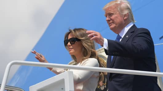 President Donald Trump and First Lady Melania Trump make their way to board Air Force One before departing from Andrews Air Force Base in Maryland on May 19, 2017.
