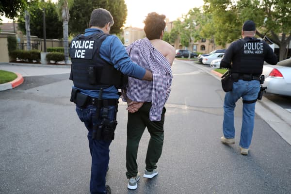 U.S. Immigration and Customs Enforcement (ICE) officers, arrest an immigrant in San Clemente, California.