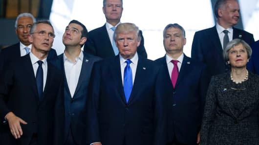 U.S. President Donald Trump poses with fellow world leaders during a NATO summit in Brussels, Belgium, May 25, 2017.