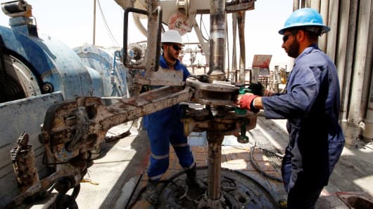 Men work for the Iraqi Drilling Company on the Rumaila oil field in Basra, Iraq.