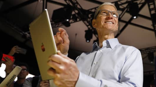 Tim Cook, CEO, holds an iPad Pro after his keynote address to Apple's annual world wide developer conference (WWDC) in San Jose, California, U.S. June 5, 2017.