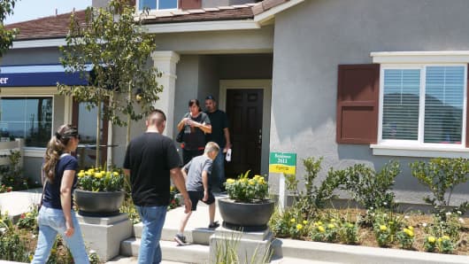 Prospective home owners tour a home in Jurupa Valley, California.