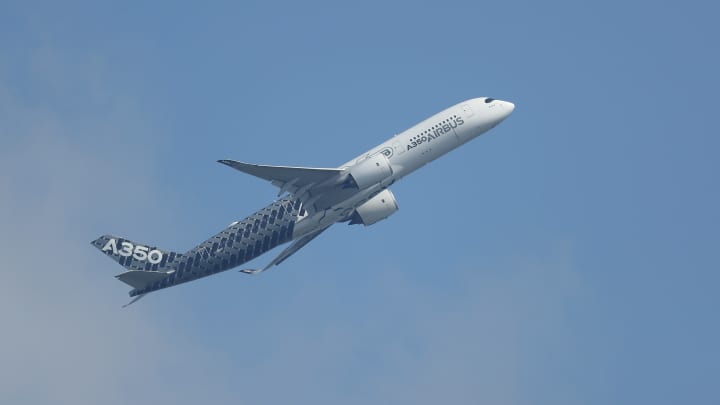 An Airbus A350 flies at the ILA 2016 Berlin Air Show on June 1, 2016 in Schoenefeld, Germany.