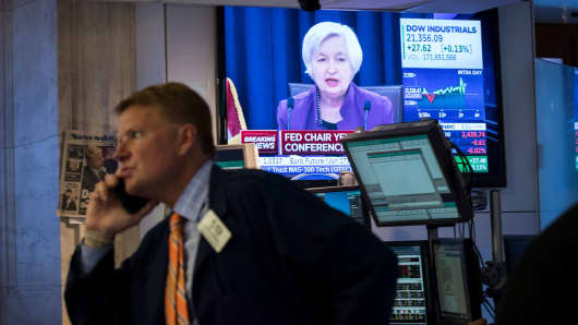 Traders work on the floor of the New York Stock Exchange as Federal Reserve Chair Janet Yellen announces the Fed's decision to raise interest rates on June 14, 2017.