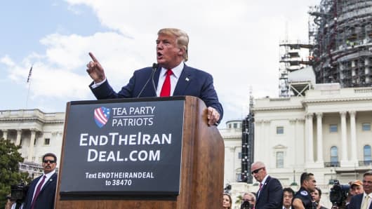 Then-candidate for the Republican Presidential nomination Donald Trump speaks during a rally held by the Tea Party at the United States Capitol to speak out against President Obama's nuclear agreement with Iran in Washington, on September 9, 2015.