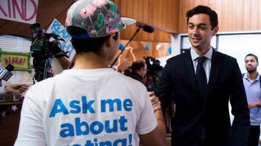 Democratic candidate for Georgia's 6th Congressional district Jon Ossoff shakes hands with campaign workers and volunteers in Sandy Spring, Ga., on Sunday, June 18, 2017.