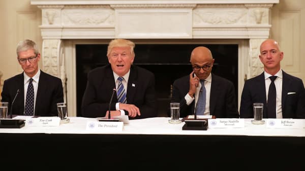 President Donald Trump (2nd L) welcomes members of his American Technology Council, including (L-R) Apple CEO Tim Cook, Microsoft CEO Satya Nadella and Amazon CEO Jeff Bezos in the State Dining Room of the White House June 19, 2017 in Washington, DC.