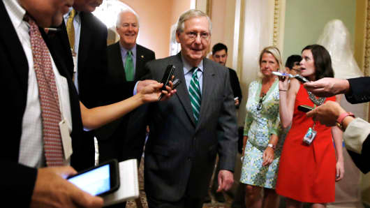 Senate Majority Leader Mitch McConnell of Ky., center, followed by Majority Whip John Cornyn, R-Texas, leaves a Republican meeting on healthcare, Thursday, June 22, 2017, on Capitol Hill in Washington.