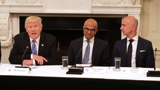 President Donald Trump, Microsoft CEO Satya Nadella and Amazon CEO Jeff Bezos attend a meeting of the American Technology Council in the State Dining Room of the White House June 19, 2017 in Washington, DC.