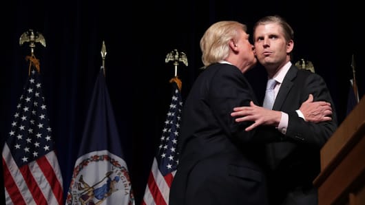 Then presidential candidate Donald Trump with his son Eric Trump during a campaign event at Briar Woods High School August 2, 2016 in Ashburn, Virginia.