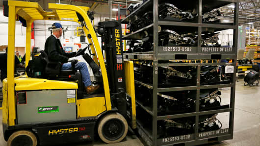 A worker operates a forklift to move parts used to assembled car seats at the Lear Corp. manufacturing facility in Hammond, Indiana.