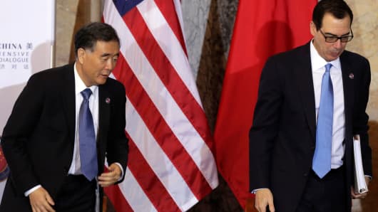 Treasury Secretary Steve Mnuchin (R) and China's Vice Premier Wang Yang arrive at the U.S. - China Comprehensive Economic Dialogue to discuss bilateral economic and trade issues in Washington, U.S., July 19, 2017.