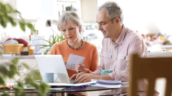Premium: Older couple assessing retirement savings