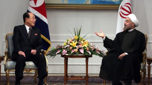 Iran's President Hassan Rouhani meets with North Korea's ceremonial head of state, Kim YongcNam in 2013. 
