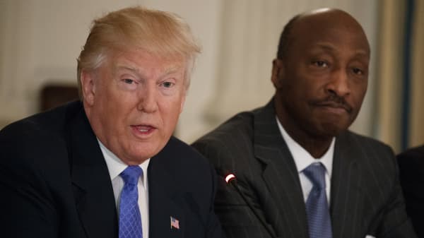 Merck CEO Kenneth Frazier listens at right as President Donald Trump speaks during a meeting with manufacturing executives at the White House in Washington, Thursday, Feb. 23, 2017.