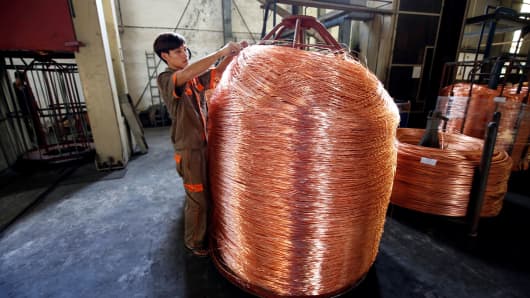 A worker labels copper products at Truong Phu cable factory in northern Hai Duong province, outside Hanoi, Vietnam August 11, 2017.