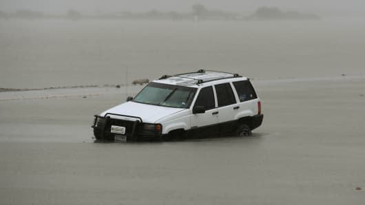 A car lies submerged after Hurricane Harvey hit Corpus Christi, Texas on August 26, 2017.