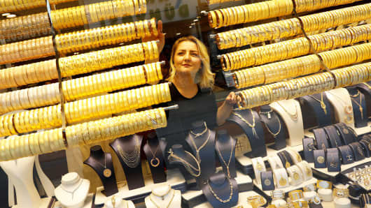 A woman checks products in a gold and jewelery store in Corum, Turkey.
