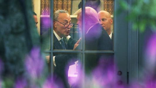 Senate Minority Leader Chuck Schumer (D-NY) (L) makes a point to President Donald Trump in the Oval Office prior to his departure from the White House September 6, 2017 in Washington, DC.