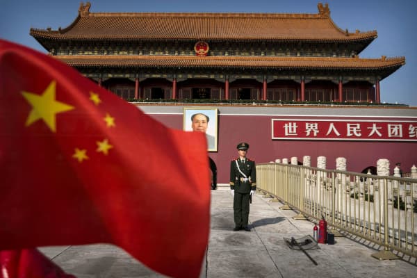 A Chinese soldier stands guard in front of Tiananmen Gate outside the Forbidden City in Beijing, China.