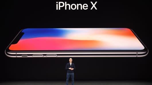 Apple CEO Tim Cook speaks about the new iPhone X during a media event at Apple's new headquarters in Cupertino, California on September 12, 2017.