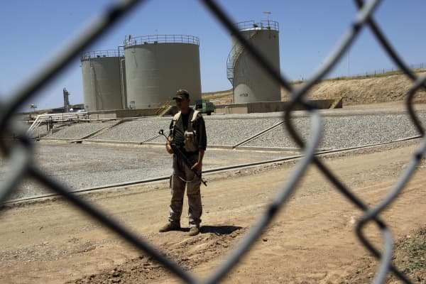 A security guard is seen at the Tawke oil refinery near the village of Zacho, in the autonomous Iraqi region of Kurdistan, on May 31, 2009.
