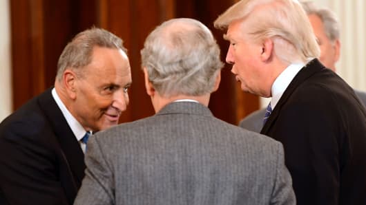 President Donald Trump (R) hosts a reception for House and Senate Republican and Democratic leaders in the State Dining Room of the White House January 23, 2017 in Washington, DC. Attending were Senate Minority Leader Chuck Schumer (D-NY) (L) and Senate Majority Leader Mitch McConnell (R-KY).