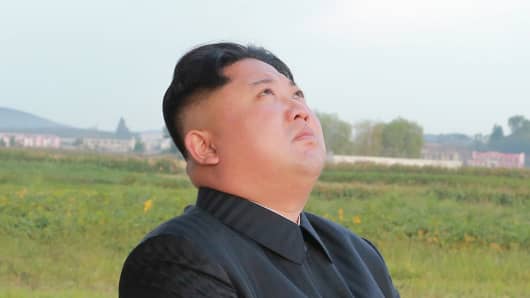 North Korean leader Kim Jong Un watches the launch of his country's own Hwasong-12 missile in this undated photo released by North Korea's Korean Central News Agency (KCNA) on September 16, 2017.