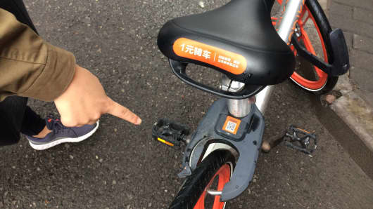The bike unlocks after the customer scans its QR code through a bike-sharing app.