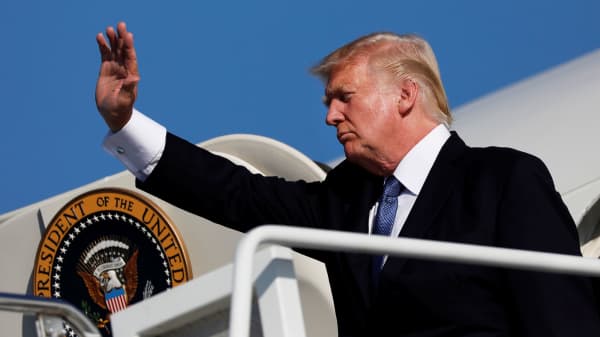President Donald Trump waves as he boards Air Force One in Morristown, New Jersey, September 24, 2017.