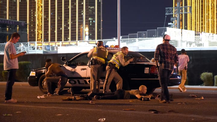 Las Vegas police stand guard along the streets outside the the Route 91 Harvest country music festival grounds after a active shooter was reported on October 1, 2017 in Las Vegas, Nevada.