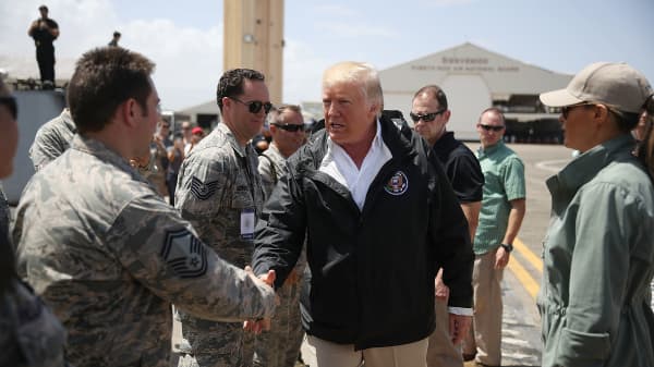 President Donald Trump greets U.S Air Force airmen as he arrives at the Muniz Air National Guard Base as he makes a visit after Hurricane Maria hit the island on October 3, 2017 in Carolina, Puerto Rico.