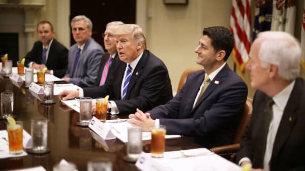 President Donald Trump (C) hosts Office of Managment and Budget Director Mick Mulvaney (L) and Republican Congressional leaders (2nd L-R) Rep. Kevin McCarthy (R-CA); Senate Majority Leader Mitch McConnell (R-KY), Speaker of the House Paul Ryan (R-WI), Sen. John Cornyn (R-TX) and others during a working lunch in the Roosevelt Room at the White House March 1, 2017 in Washington, DC.