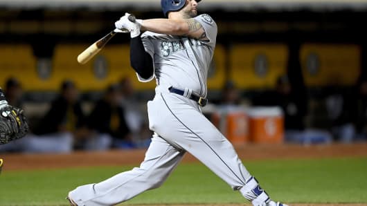 Home-run statistics track the stock market. Pictured, Yonder Alonso of the Seattle Mariners.