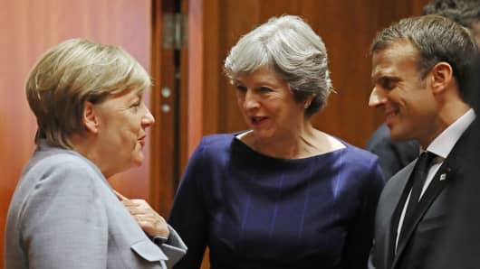 German Chancellor Angela Merkel, British PM Theresa May and French President Emmanuel Macron at Brexit talks on October 19, 2017 in Brussels, Belgium.