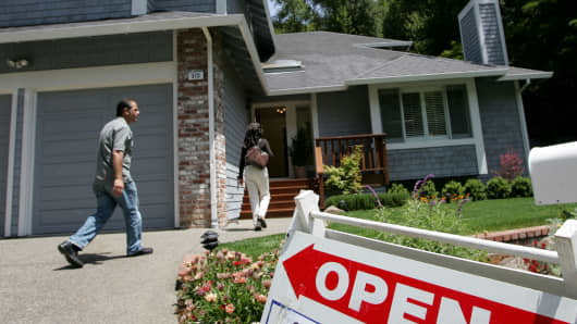 Real estate agents arrive at a brokers tour showing a house for sale with a list price of $1.3 million May 17, 2007 in San Rafael, California.