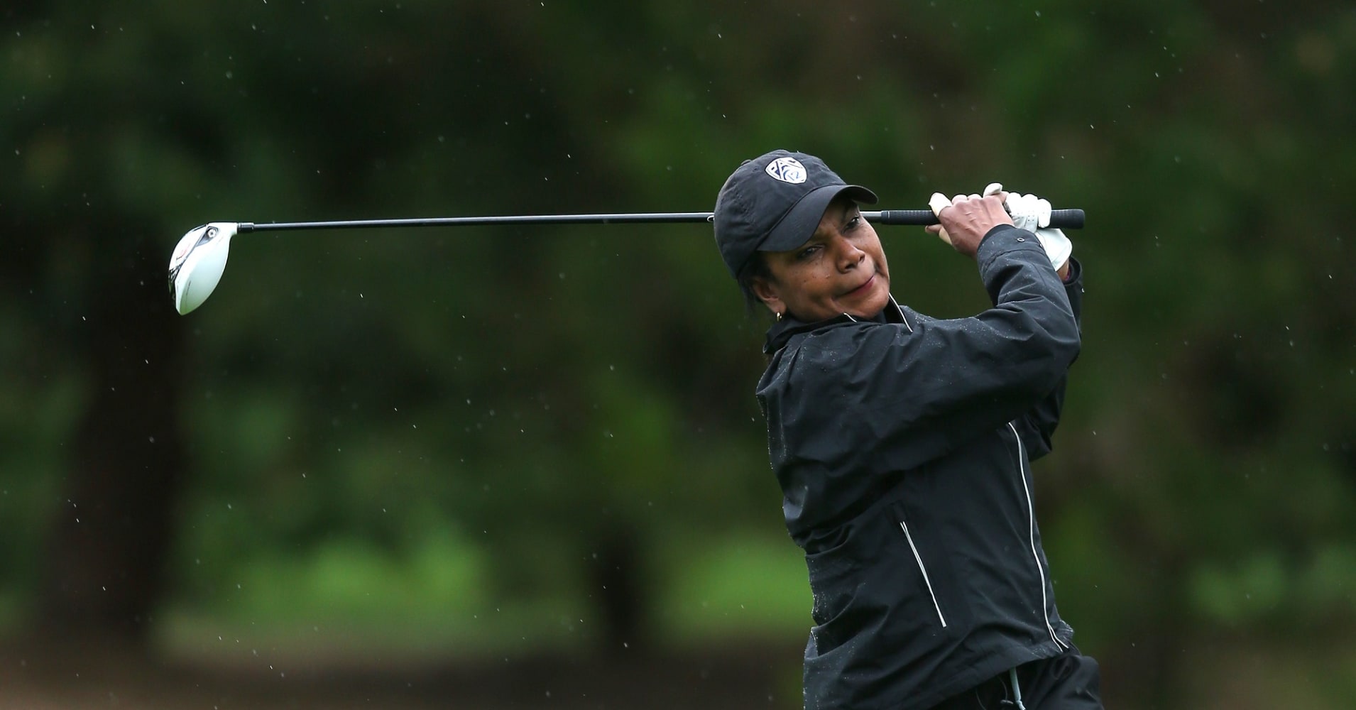 Former United States Secretary of State Condoleezza Rice hits an approach shot to the tenth green during the third round of the AT&T Pebble Beach National Pro-Am.