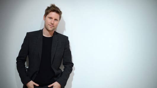British designer Christopher Bailey poses backstage ahead of his Burberry Prorsum 2013 spring/summer collection catwalk show at London Fashion Week in London on September 17, 2012.