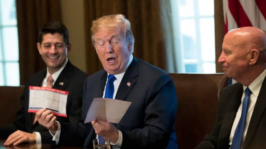 Flanked by Speaker of the House Paul Ryan and House Ways and Means Committee chairman Rep. Kevin Brady (R-TX), President Donald Trump speaks about tax reform legislation in the Cabinet Room at the White House, November 2, 2017 in Washington, DC.