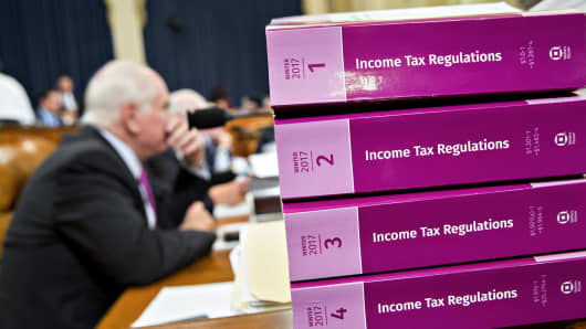 Income Tax Regulations books sit in the House Ways and Means Committee before the start of a markup hearing on the Tax Cut And Jobs Act in Washington, D.C., on Thursday, Nov. 9, 2017.
