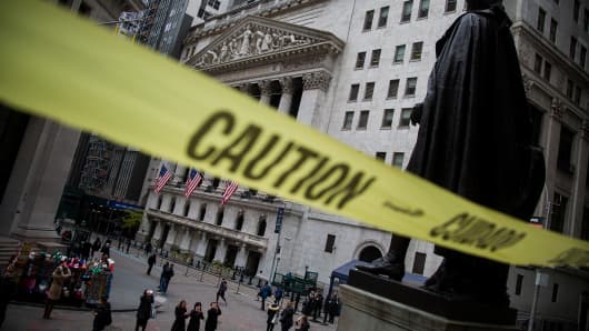 Caution tape hangs near the steps of Federal Hall across from the New York Stock Exchange in New York.