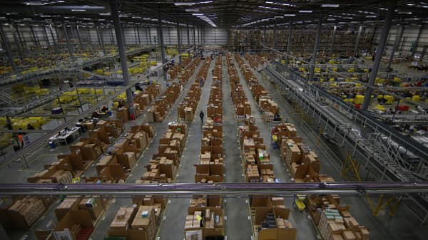 Parcels are prepared for dispatch at Amazon's warehouse in Hemel Hempstead, England.