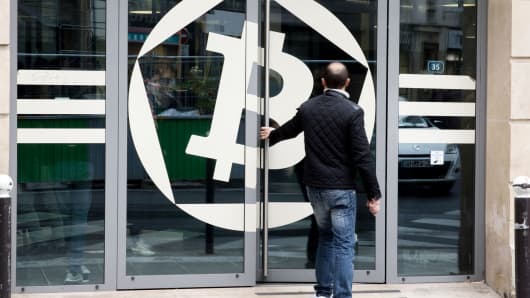 A customer enters the offices of La Maison du Bitcoin bank in Paris, France.