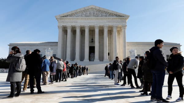 Visitors stand in line outside the Supreme Court in Washington, D.C.