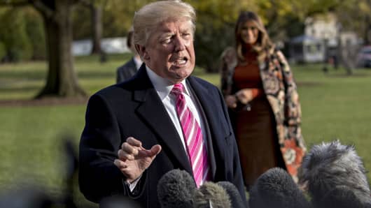 President Donald Trump speaks to members of the media before boarding Marine One on the South Lawn of the White House in Washington, D.C., on Tuesday, Nov. 21, 2017.