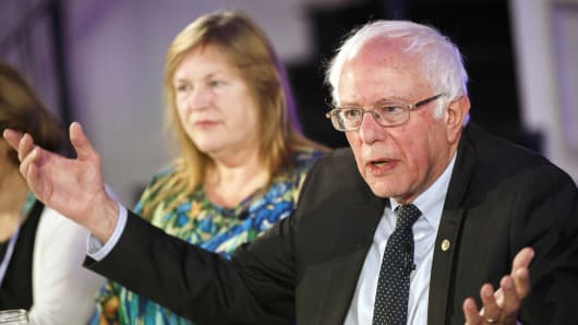 Senator Bernie Sanders, an independent from Vermont, speaks as his wife Jane Sanders looks on.